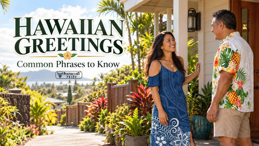 A Hawaiian woman wearing a blue cold-shoulder maxi dress with Polynesian geometric and white floral patterns smiles while greeting a man dressed in a white aloha shirt featuring colorful pineapples, tropical flowers, and green leaves. They stand outside a