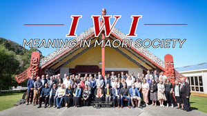 Māori community gathered outside a wharenui with the words Iwi Meaning in Māori Society