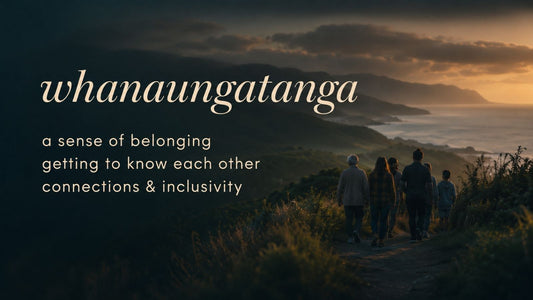 Whānau walking together through a New Zealand landscape at sunset